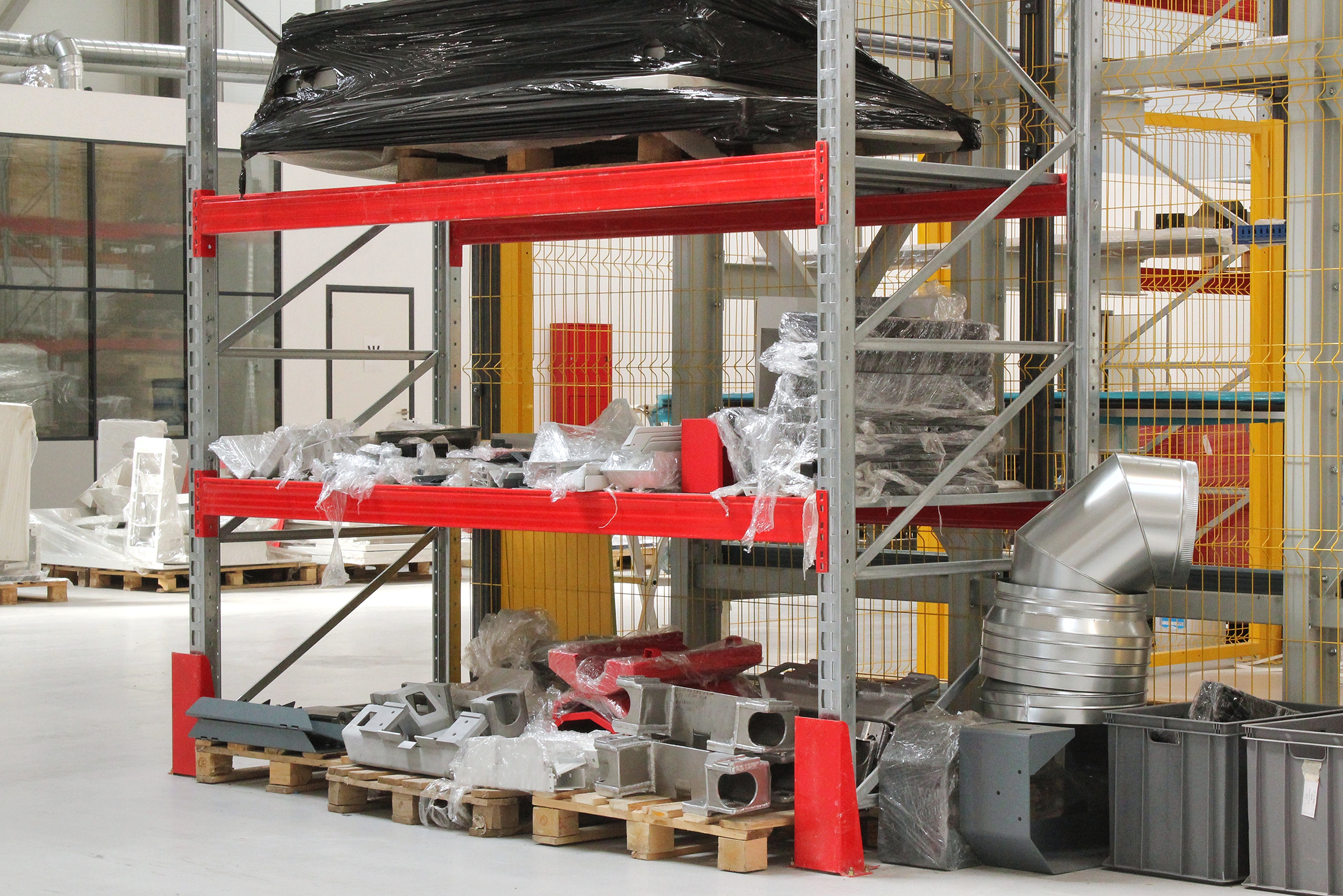 Materials and hardware staged in the warehouse for an active project